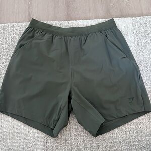 Men size medium gym shark shorts in olive green